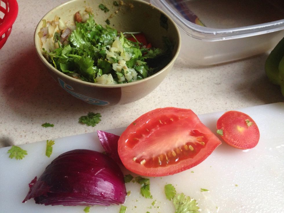 Diced half your tomato, onions, cilantro, and garlic, into small pieces into a separate bowl. All you have to do is add your salsa into this mix.