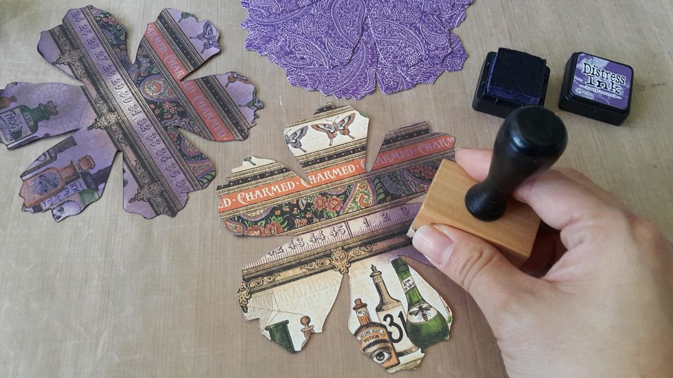 Die-cut flower panels use papers from various Graphic 45 collections as you like, use coordinate Distress Ink to color the back of each panels