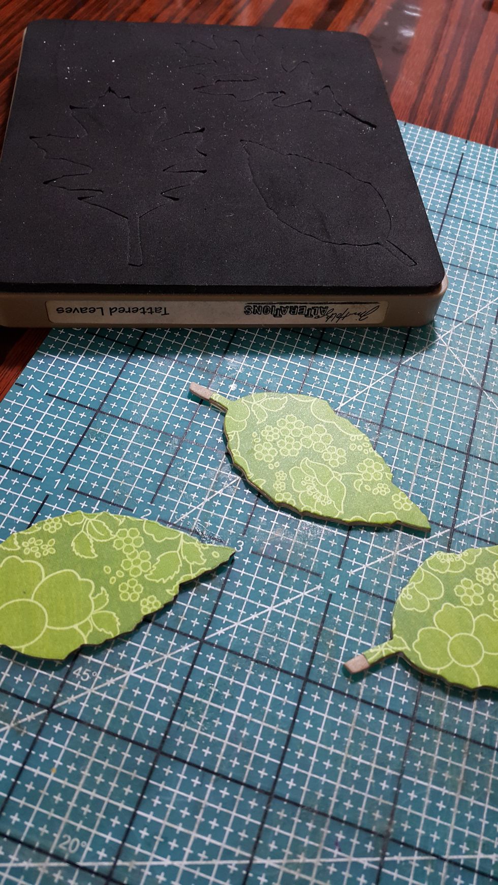 Die cut leaves shape with chipboard pieces and papers, adhere well
