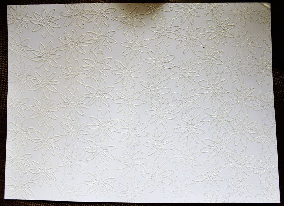 Die cut prepared embossed paper with tag die,