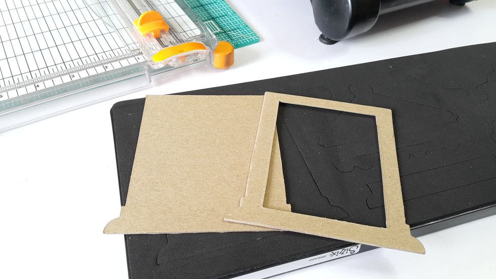 Die-cut shapes from chipboard, cut a rectangular window on one of the pieces