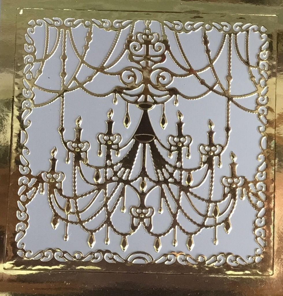 Die cut the design of your choice.  As mine is delicate I had to stick my die cut onto a card backing.  As I have to cut holes for the lights to show.