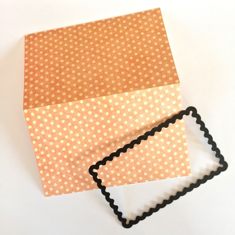 Die cut to make the window for the next page of the mini album.