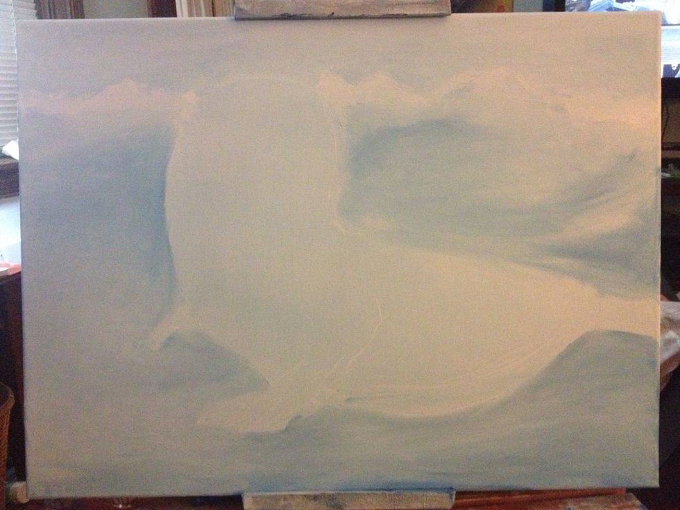 Different values of blues and whites make up the background. I started with a light blue sky and worked my way down the canvas.