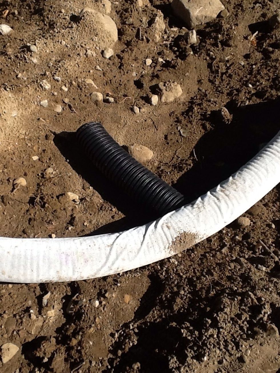 Dig a trench and put in your drain pipe