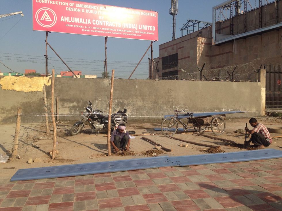 Dig hole on the ground and stand the sturuture