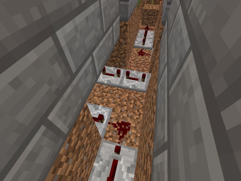 Dig out a path for redstone dust and redstone repeaters starting from the block under the pressure plate and ending at the end of the maze.