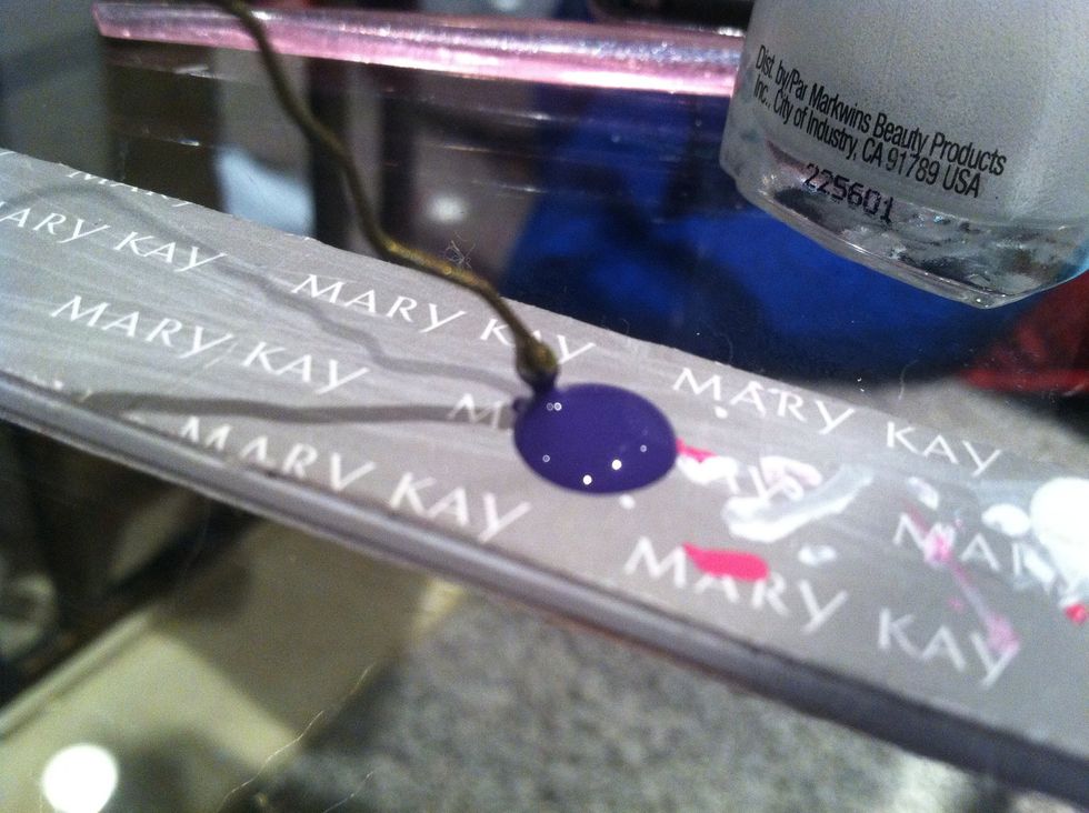 Dip a bobby pin in purple nail polish...