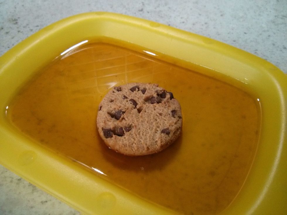 Dip a cookie into the sherry, two seconds each side.