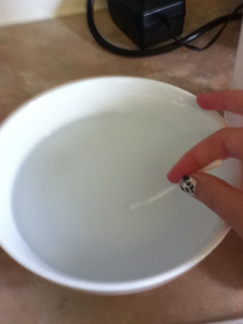Dip a ear bud into the salt solution