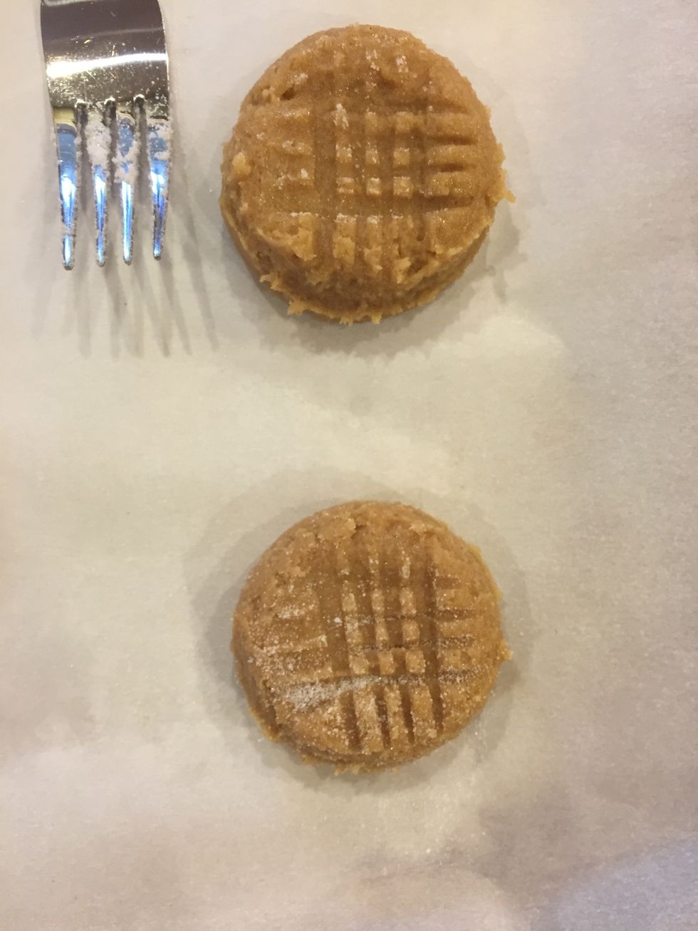 Dip a fork in sugar, and press each cookie down carefully!