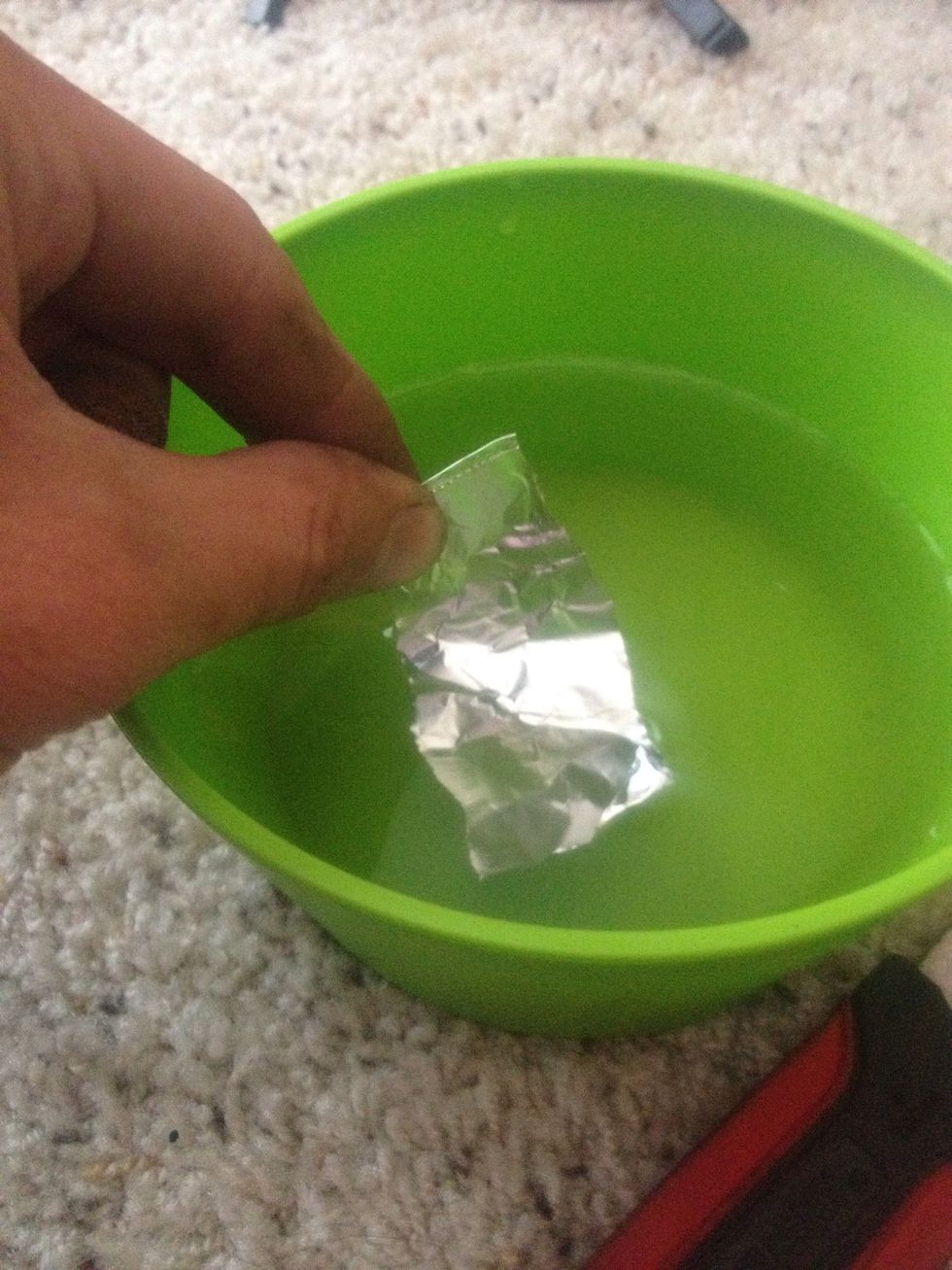 Dip a piece of foil in water.