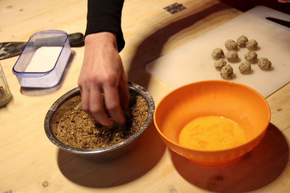 Dip again in breadcrumbs and again in egg