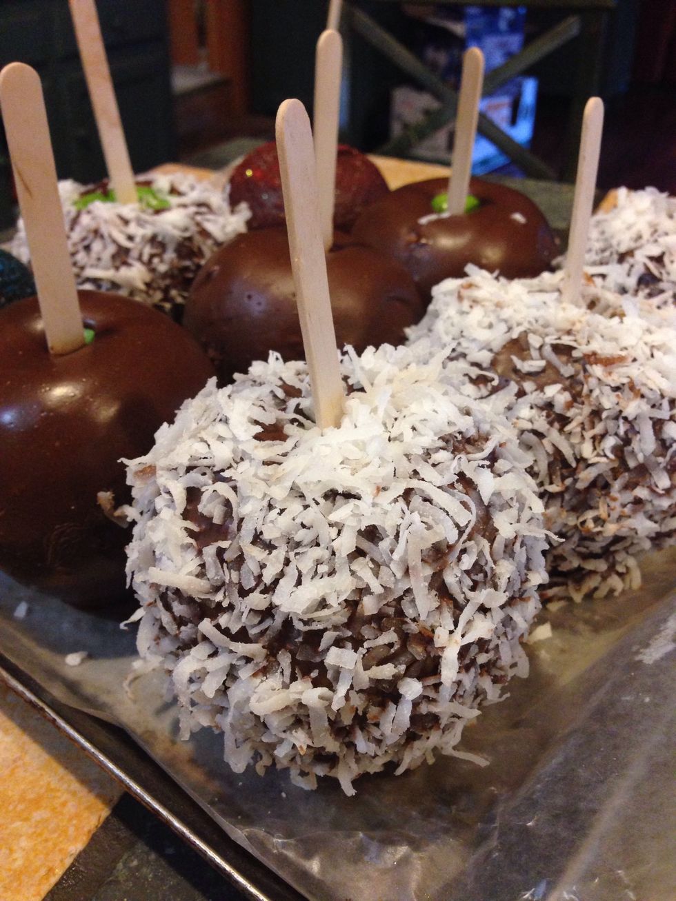 Dip apples into Pb-chocolate mixture than place onto wax paper. You can roll apples directly into the toppings or gently place them on. Chill for 15 minutes.