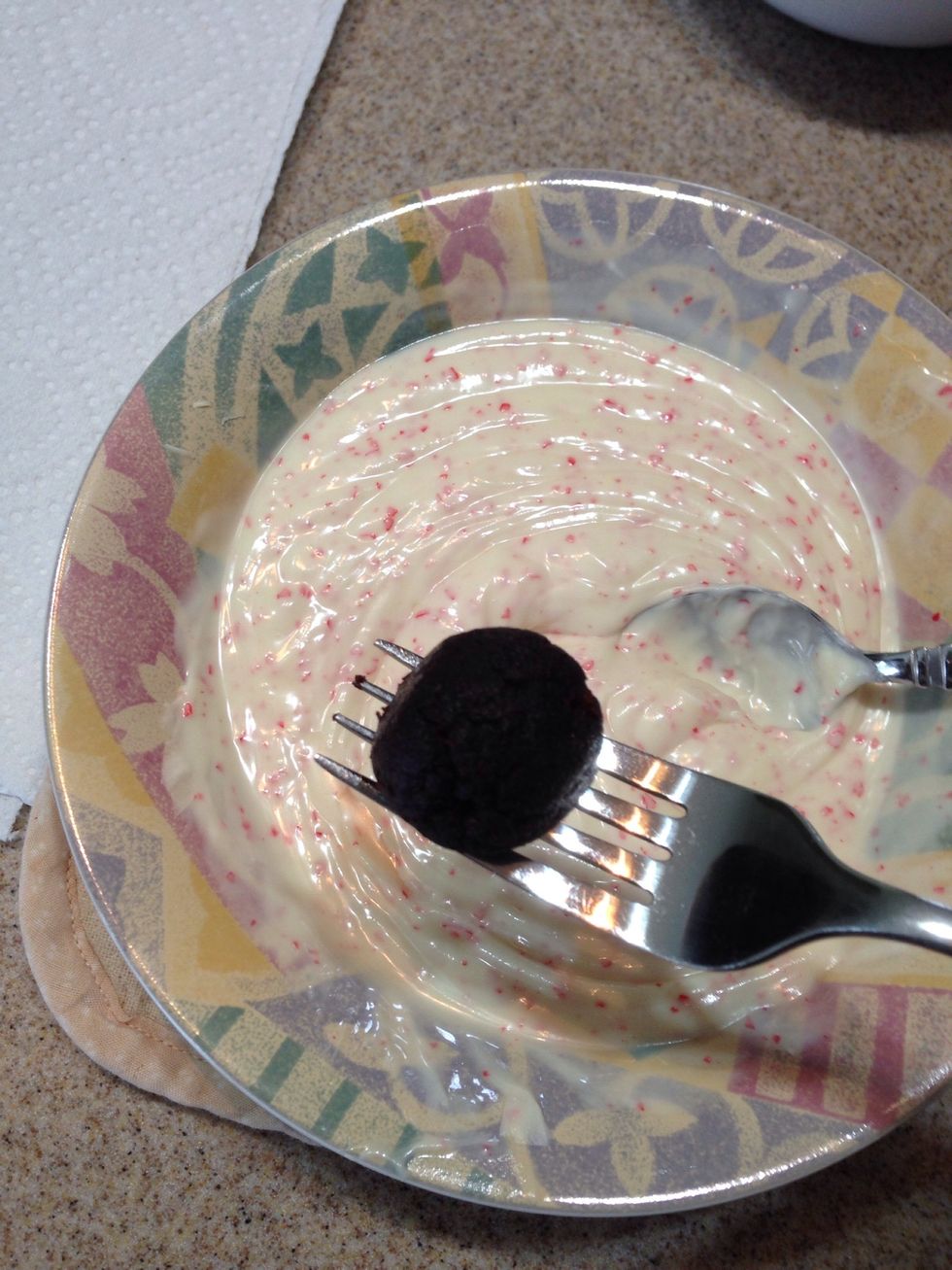 Dip each ball in the melted chocolate and cover. Set aside on wax paper.