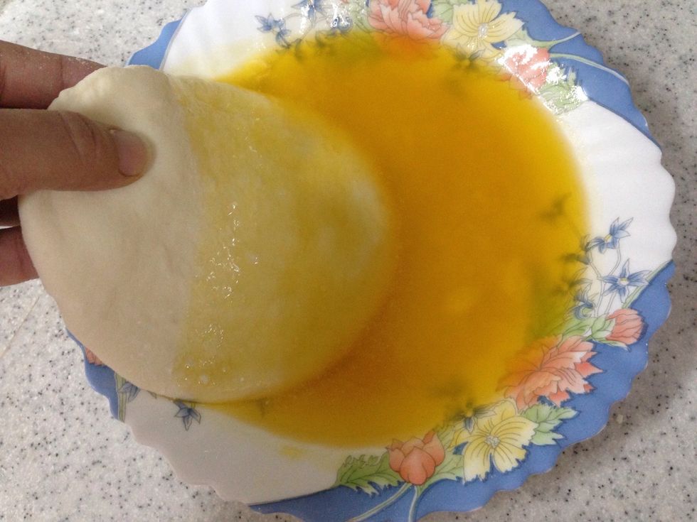 Dip each circle in the melted butter .