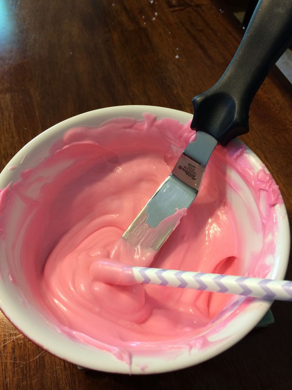Dip each stick into the melted chocolate