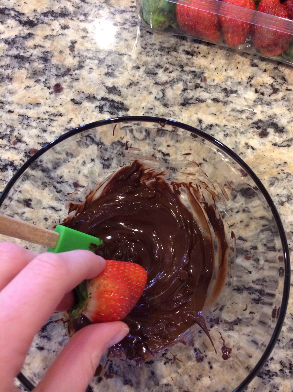 Dip each strawberry in the chocolate. I used a spatula to help coat the berries