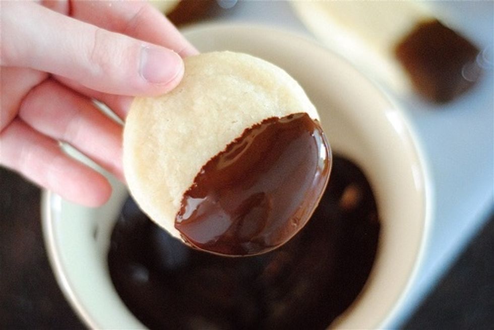 Dip half of each cookie into melted chocolate.