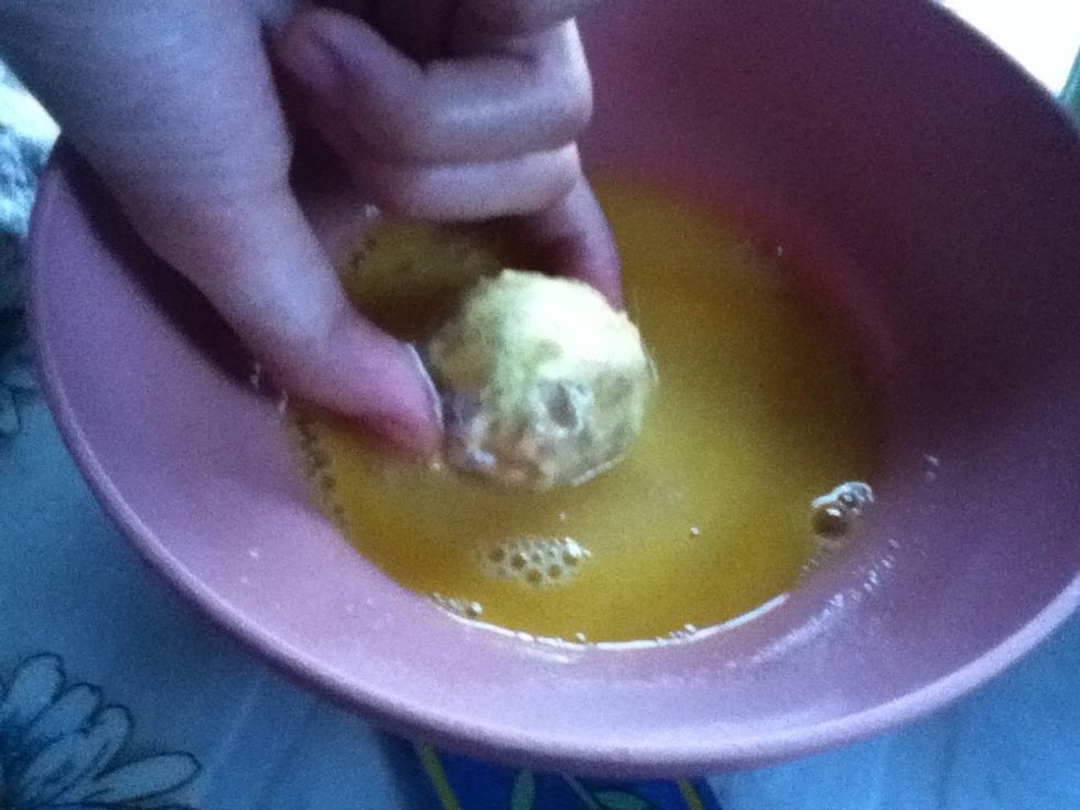 Dip in beaten egg.