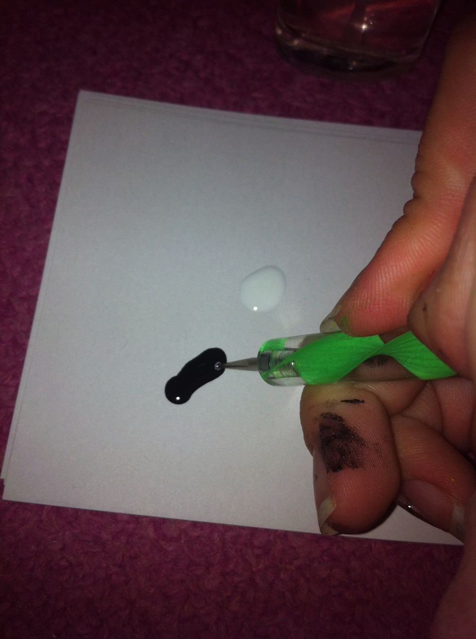 Dip it into the black polish.