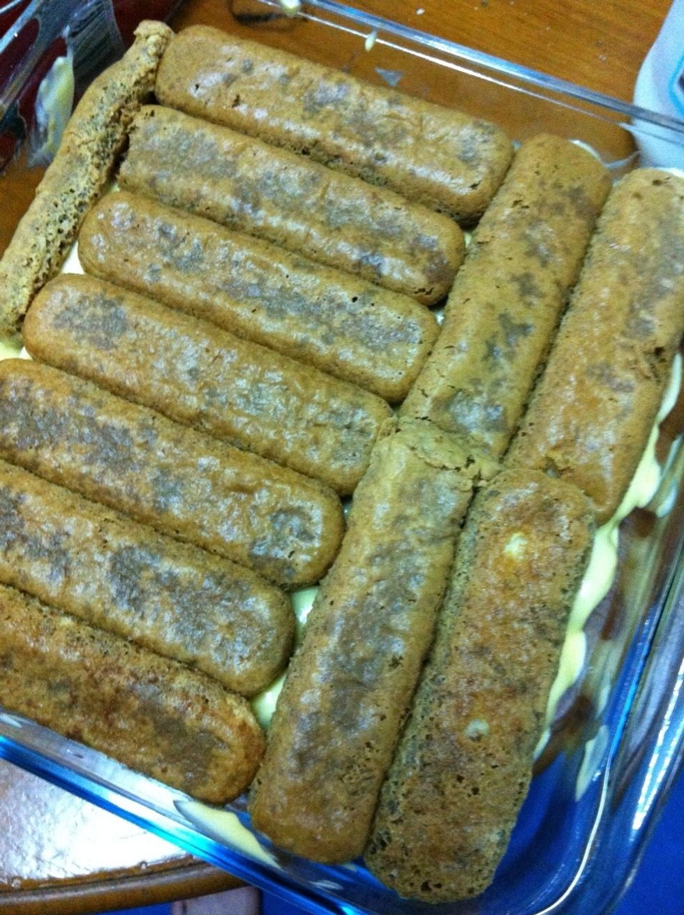 Dip ladyfinger in coffee and place