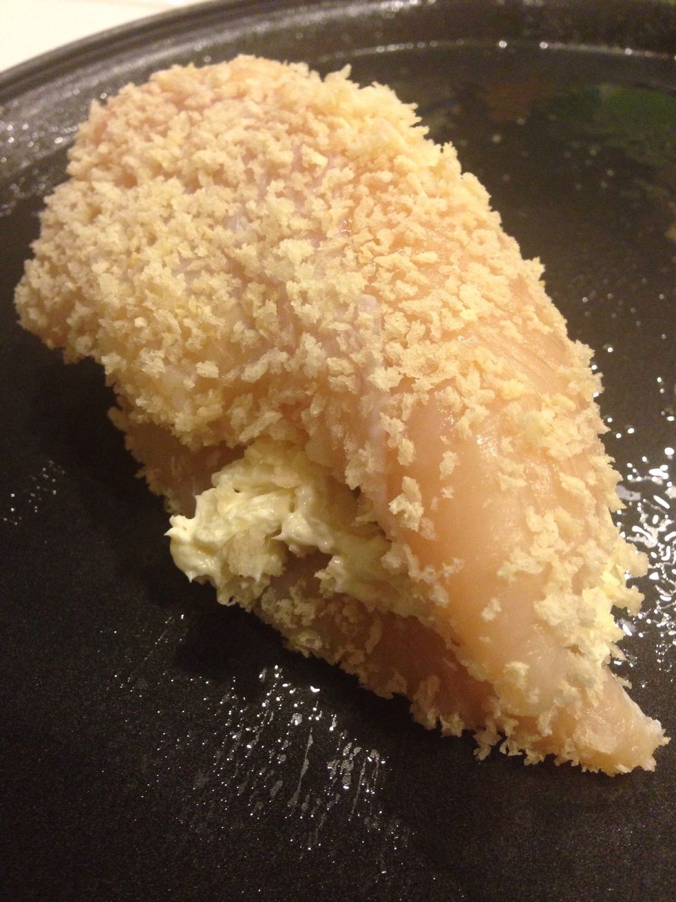 Dip one side of a second tenderloin in the Panko and lay it on top of your popper mixture. It's like a chicken-jalape\u00f1o-popper sandwich! Sprinkle with salt and pepper to taste.