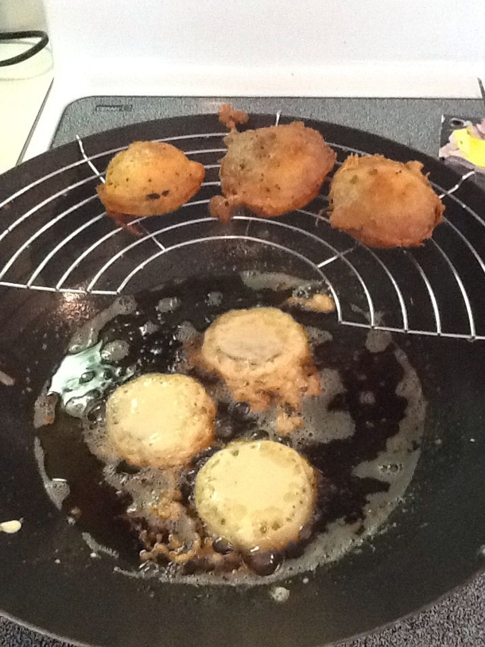 Dip Oreo cookies in batter, completely submerging the cookie, then immediately add to heated oil. When they start to brown on edges and bubble, flip the cookie to cook the other side. Drain grease.