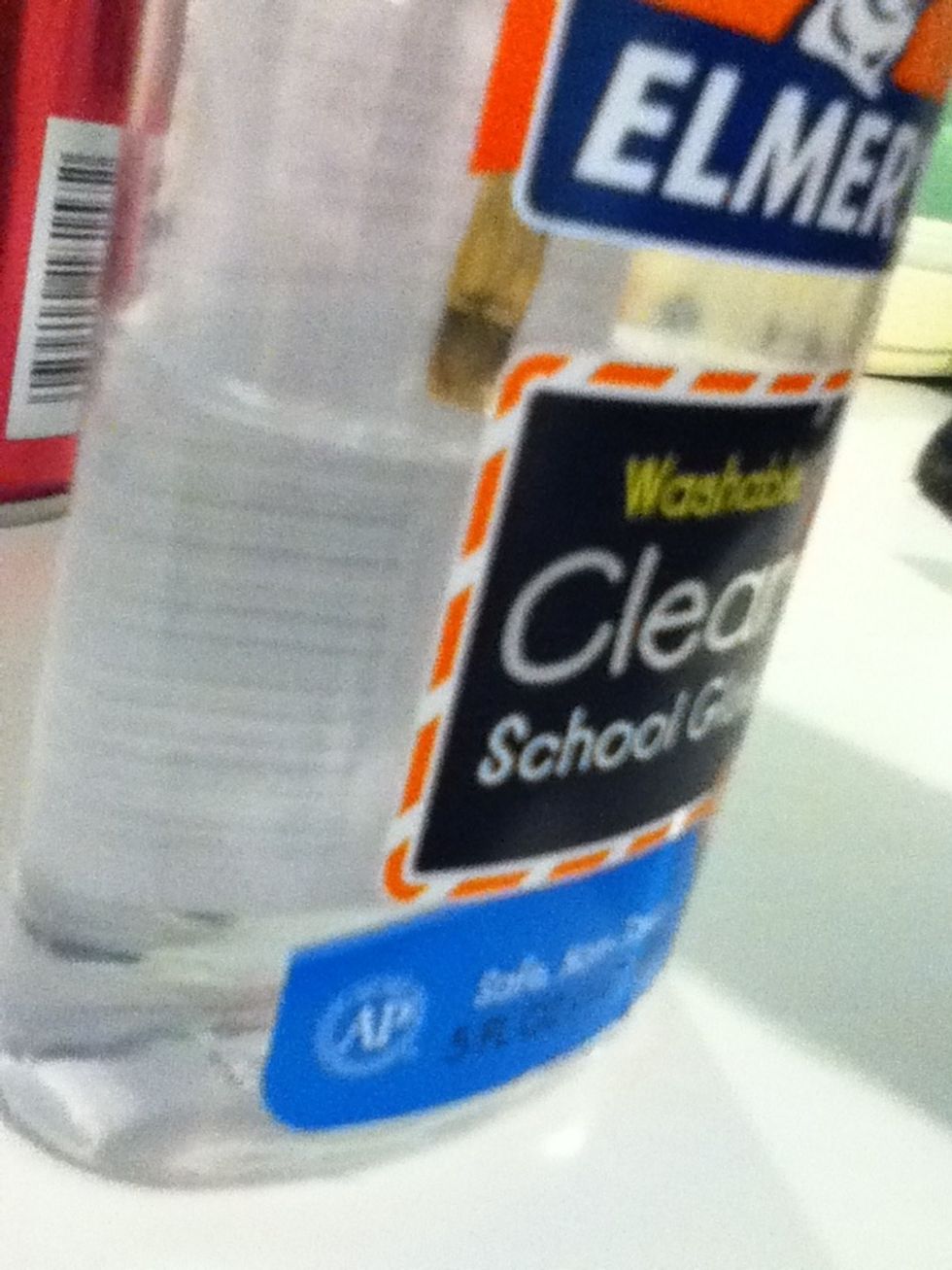 Dip paintbrush slightly in clear glue. You may have to wipe away excess glue.