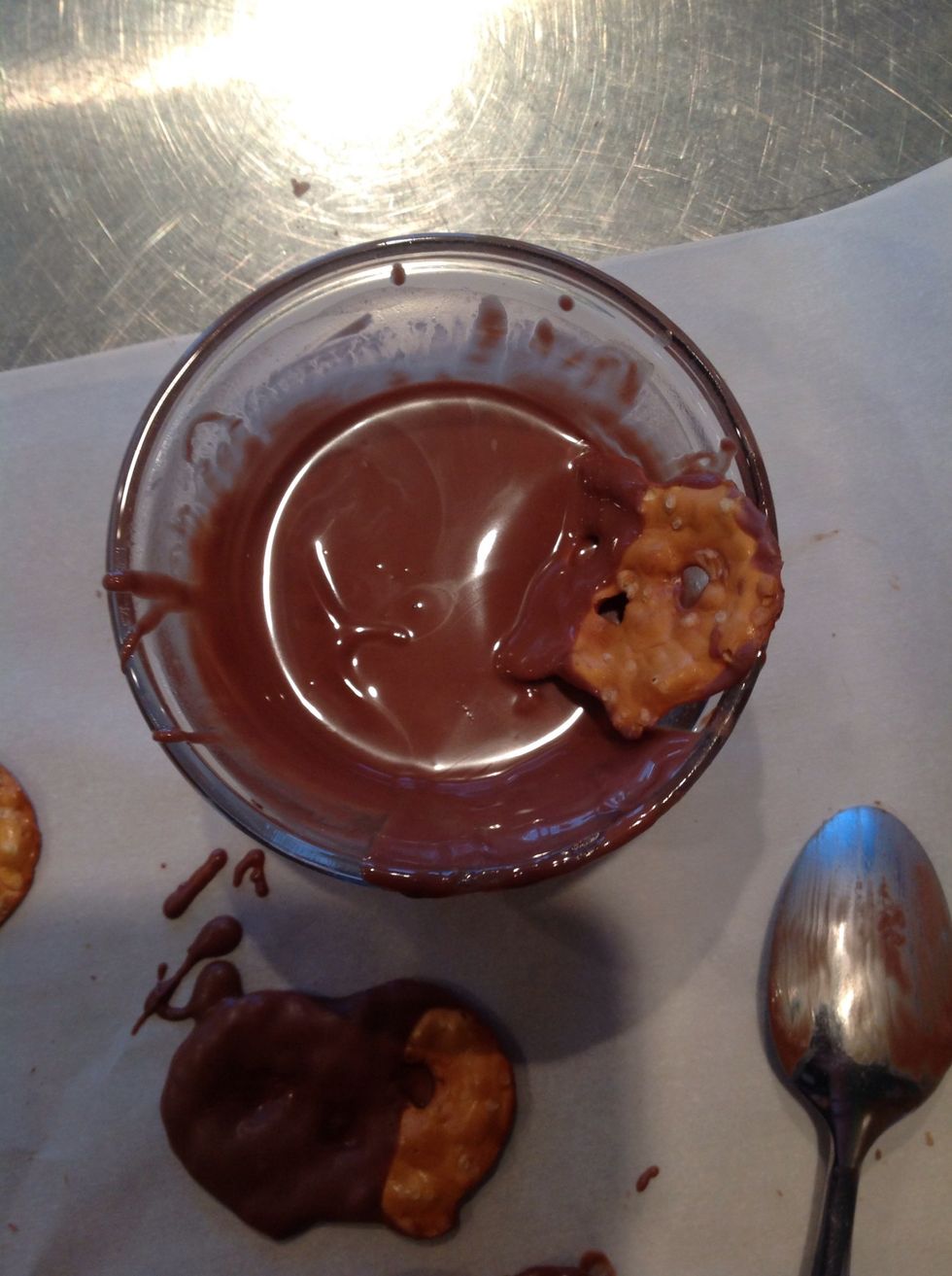 Dip pretzels in chocolate. I am leaving the top half of the pretzels out.