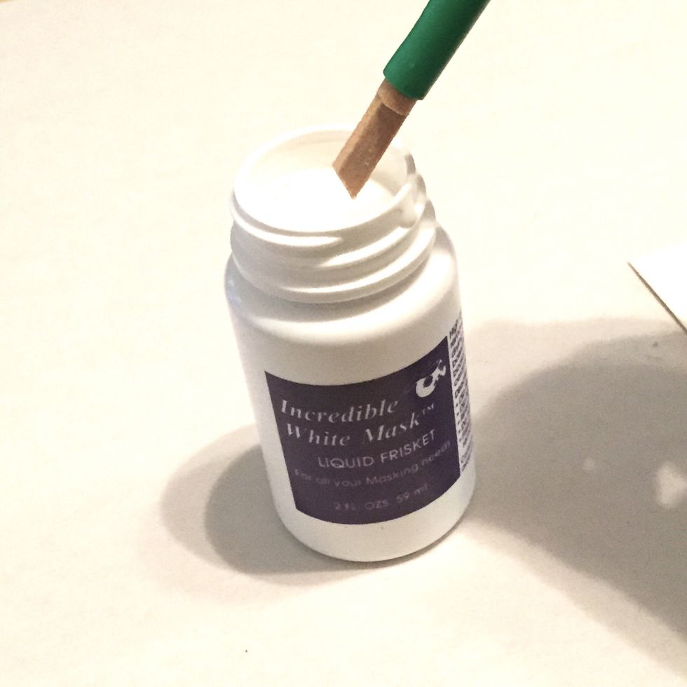dip provided Dipstik into Liquid Frisket and begin to write sentiment onto front of ivory cardstock, much as you would using a nib and ink.
