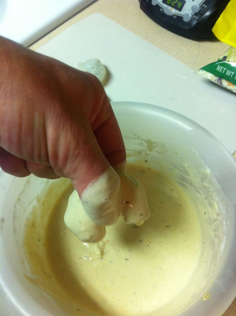 Dip shrimp in batter thoroughly.