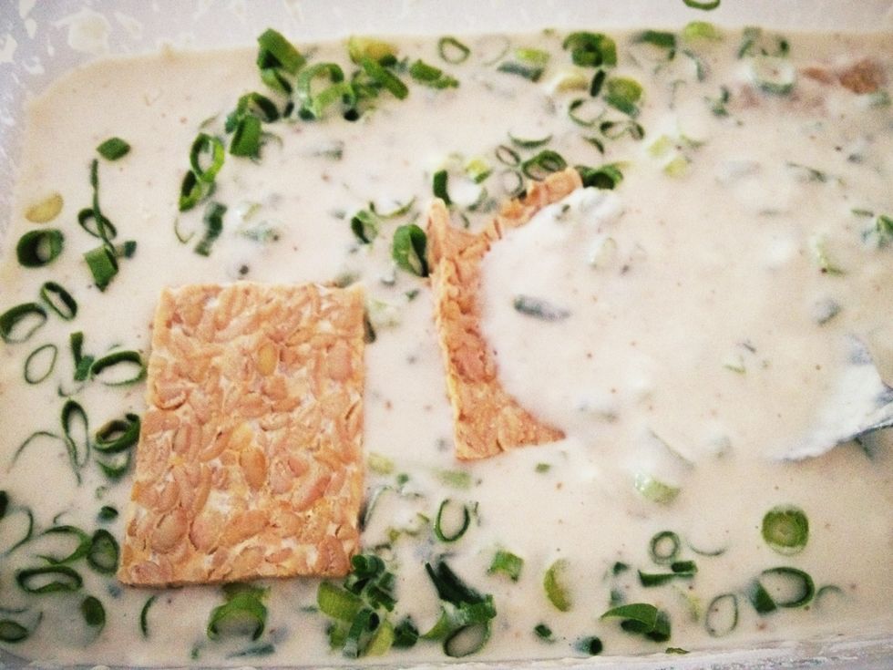 Dip tempeh slices into batter