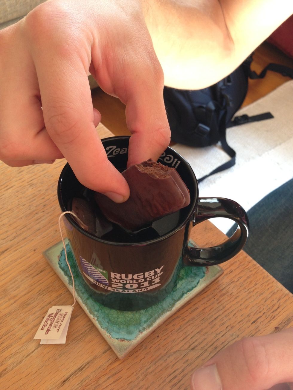 Dip the bottom of the Tim Tam in your drink and suck the liquid through the cookie as if it were a straw. Keep going until it starts to melt and quickly put the whole thing in your mouth.