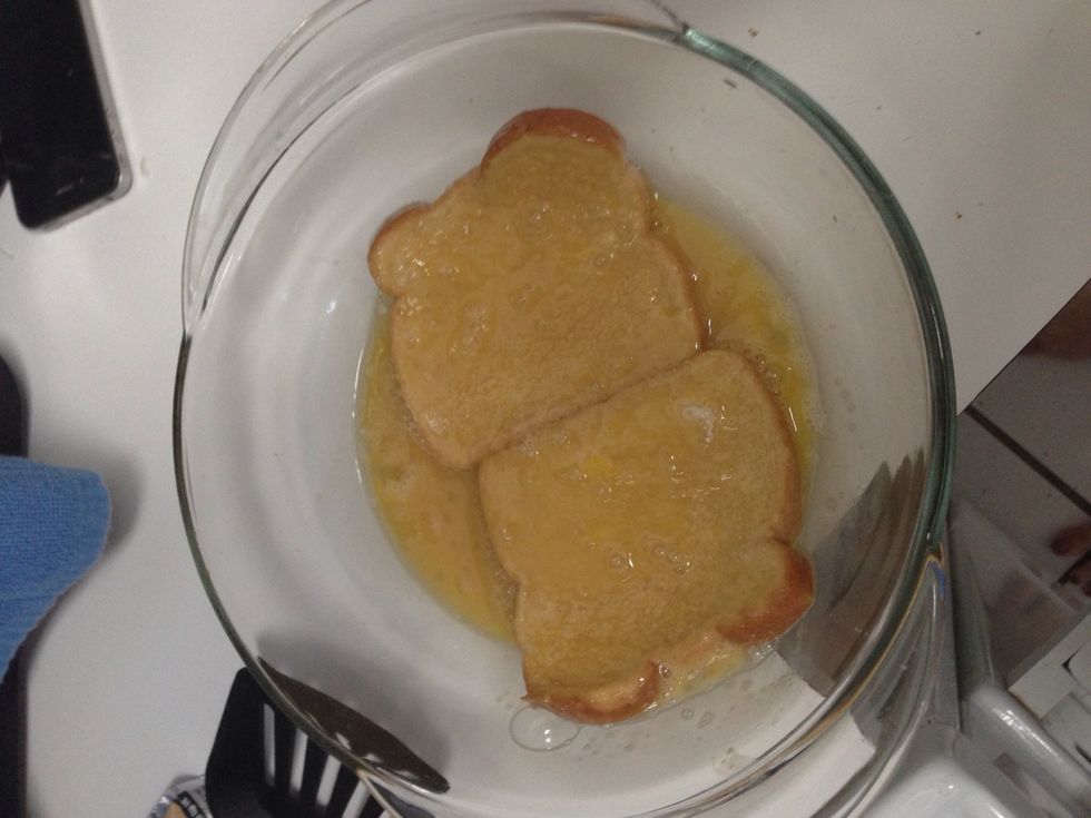 Dip the bread into the egg mixture coating both sides well.