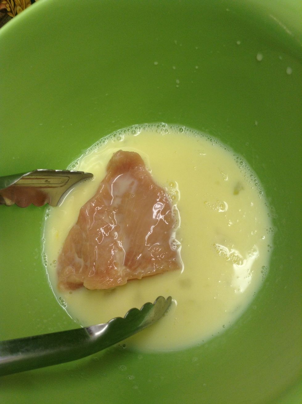 Dip the chicken in the mixture