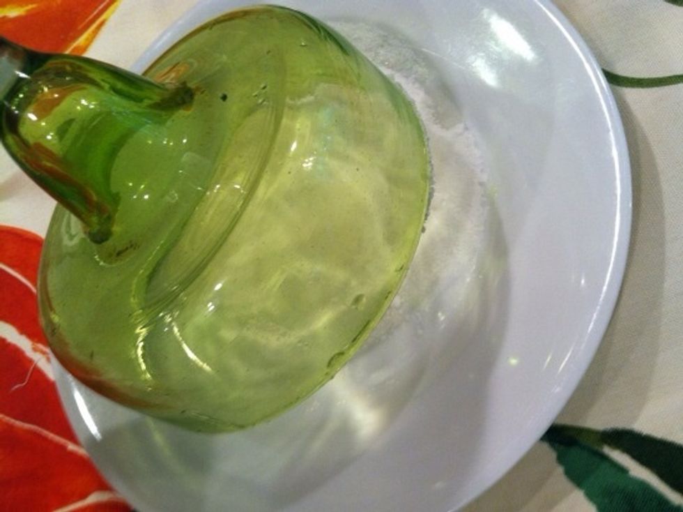 Dip the glass upside down into a small plate of sugar until rim is evenly coated.