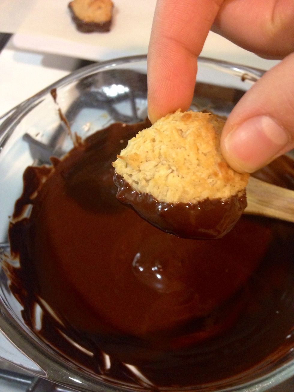 Dip the macaroons.