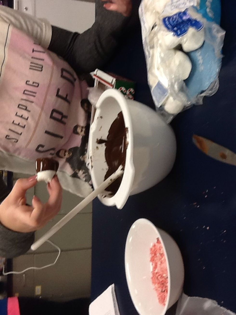 dip the mallows in the chocolate