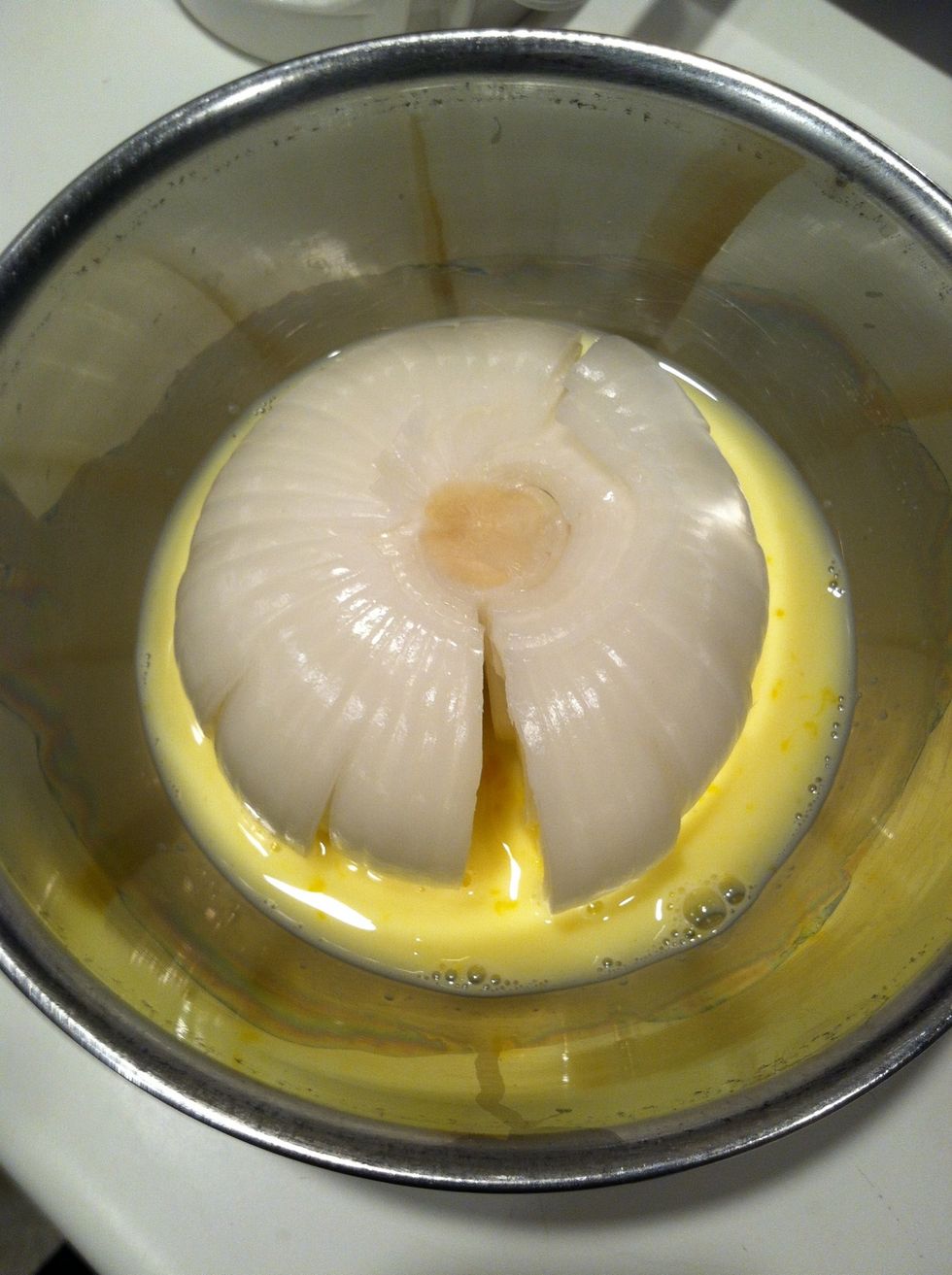 Dip the onion. Swish it, tilt the bowl, and roll the liquid around for good coverage.