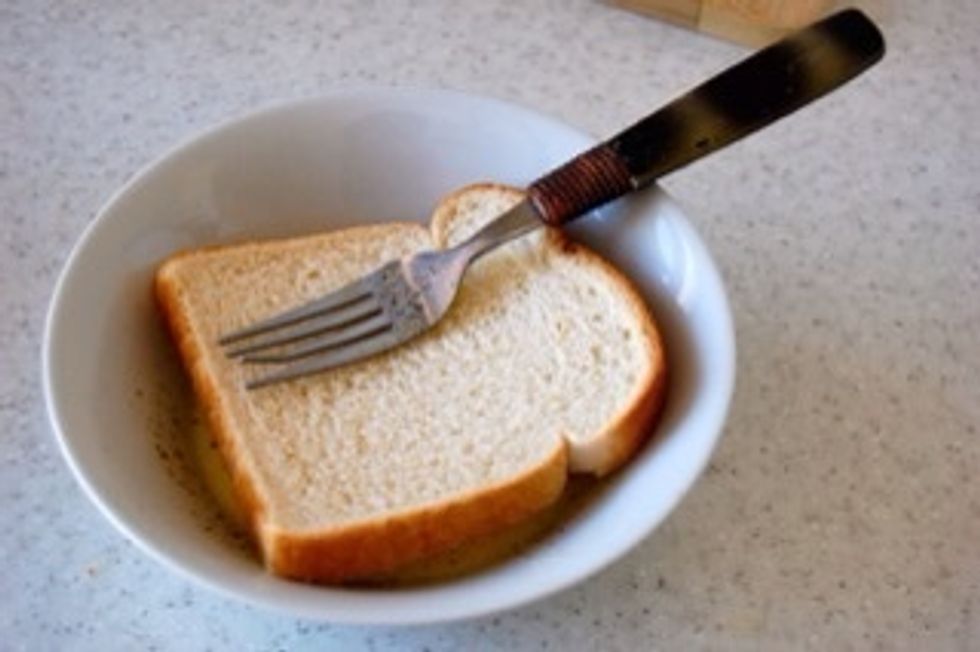 Dip the slice of bread face down until fully soaked.