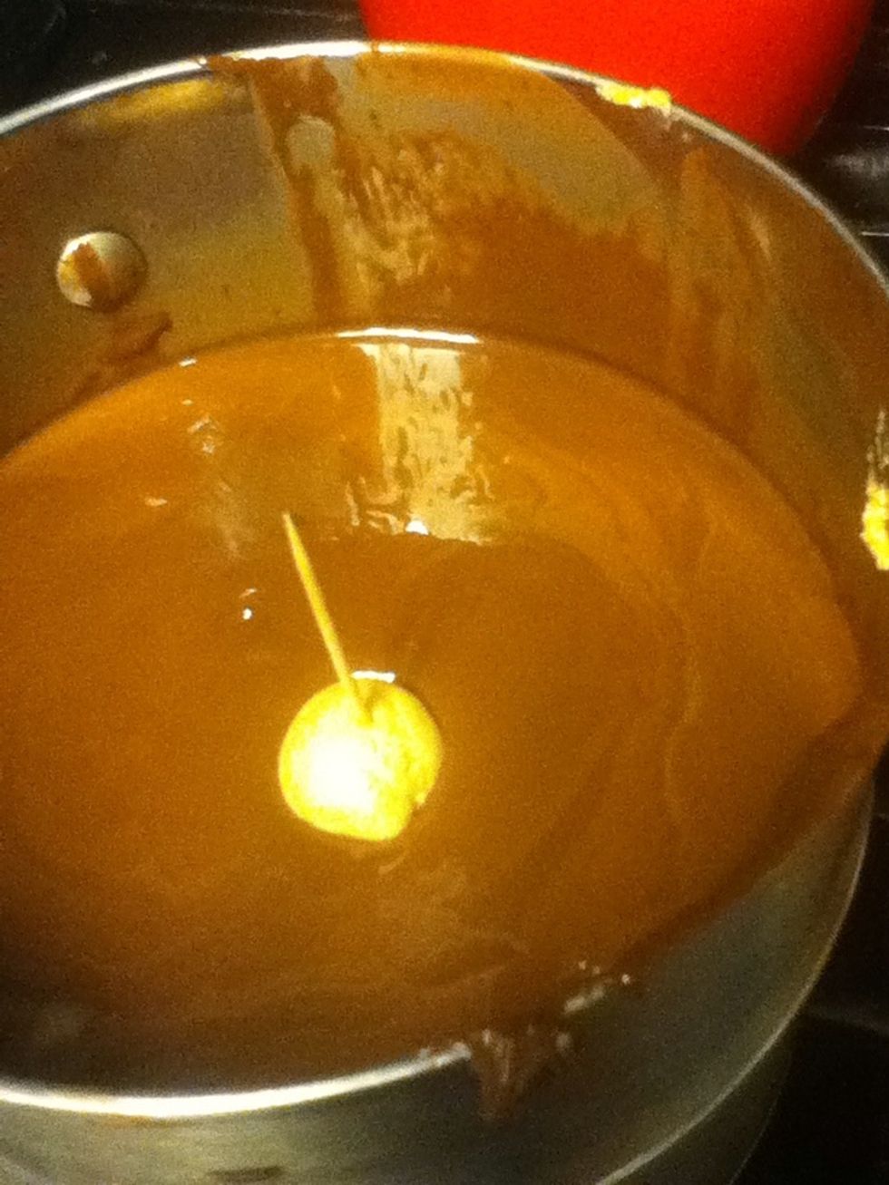 Dip them in the wax and stir it around a little bit.