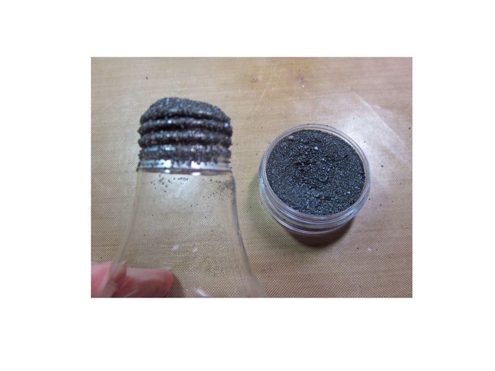 Dip your blub in the embossing powder and heat set. Then repeat with the turquoise to get a mixed look. Be sure to plug the top of your blub with a bit of tissue so you don't get powder inside.