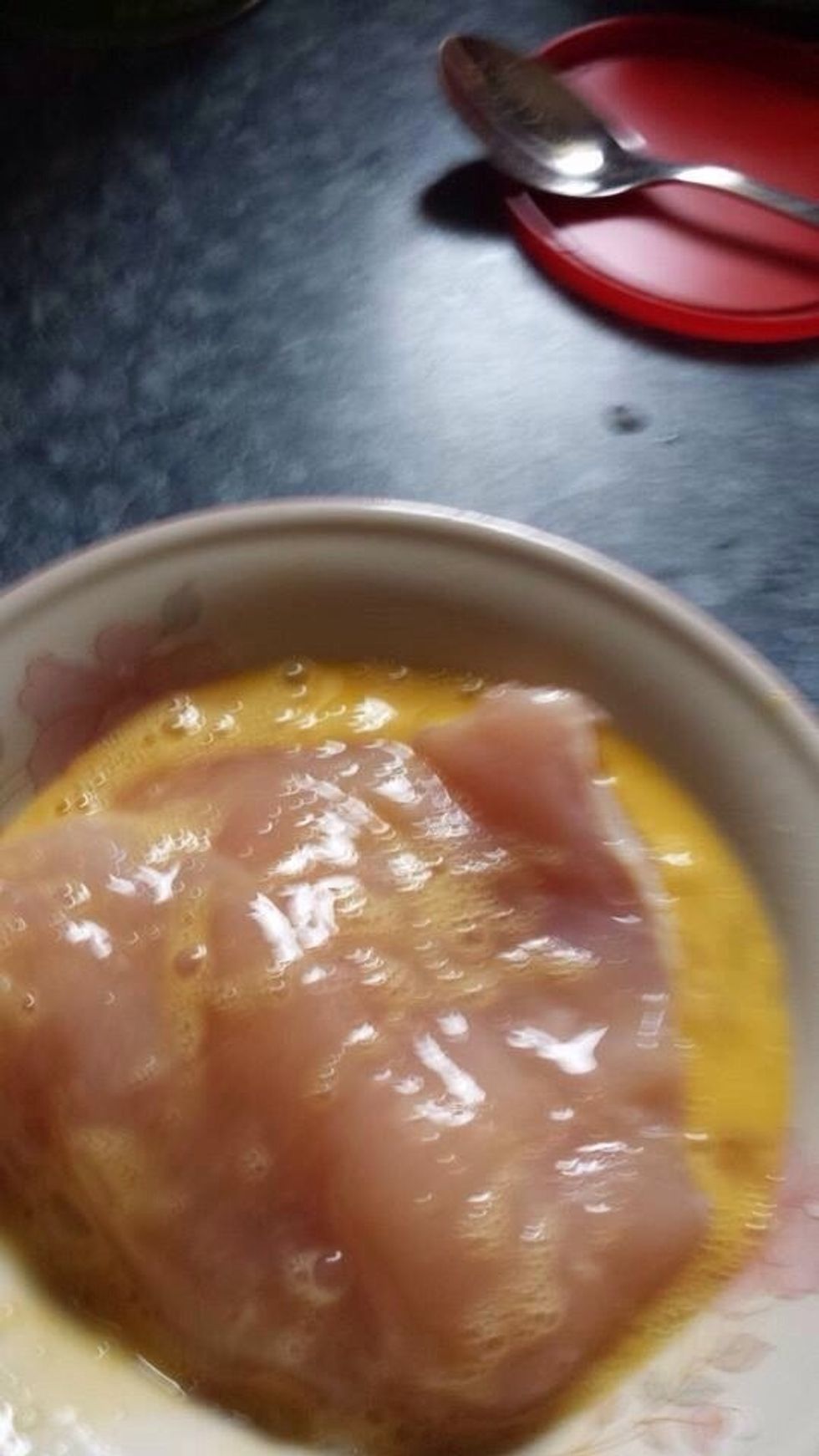 Dip your chicken in egg mixture.