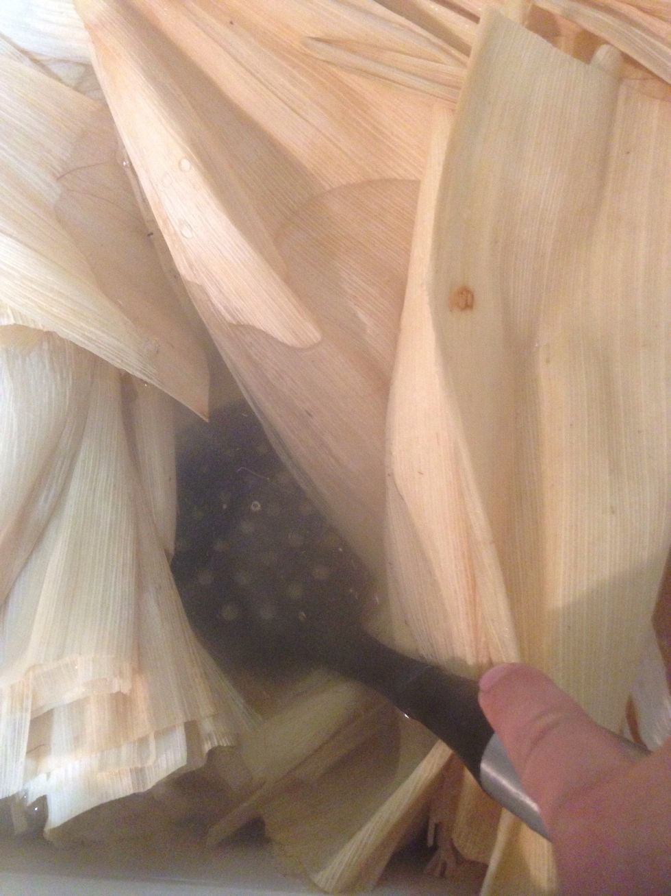 Dip your corn husk wrapper in water for 15-20 min. Then rip some of the corn husk (you gonna used it to tie both side of tamales with it)