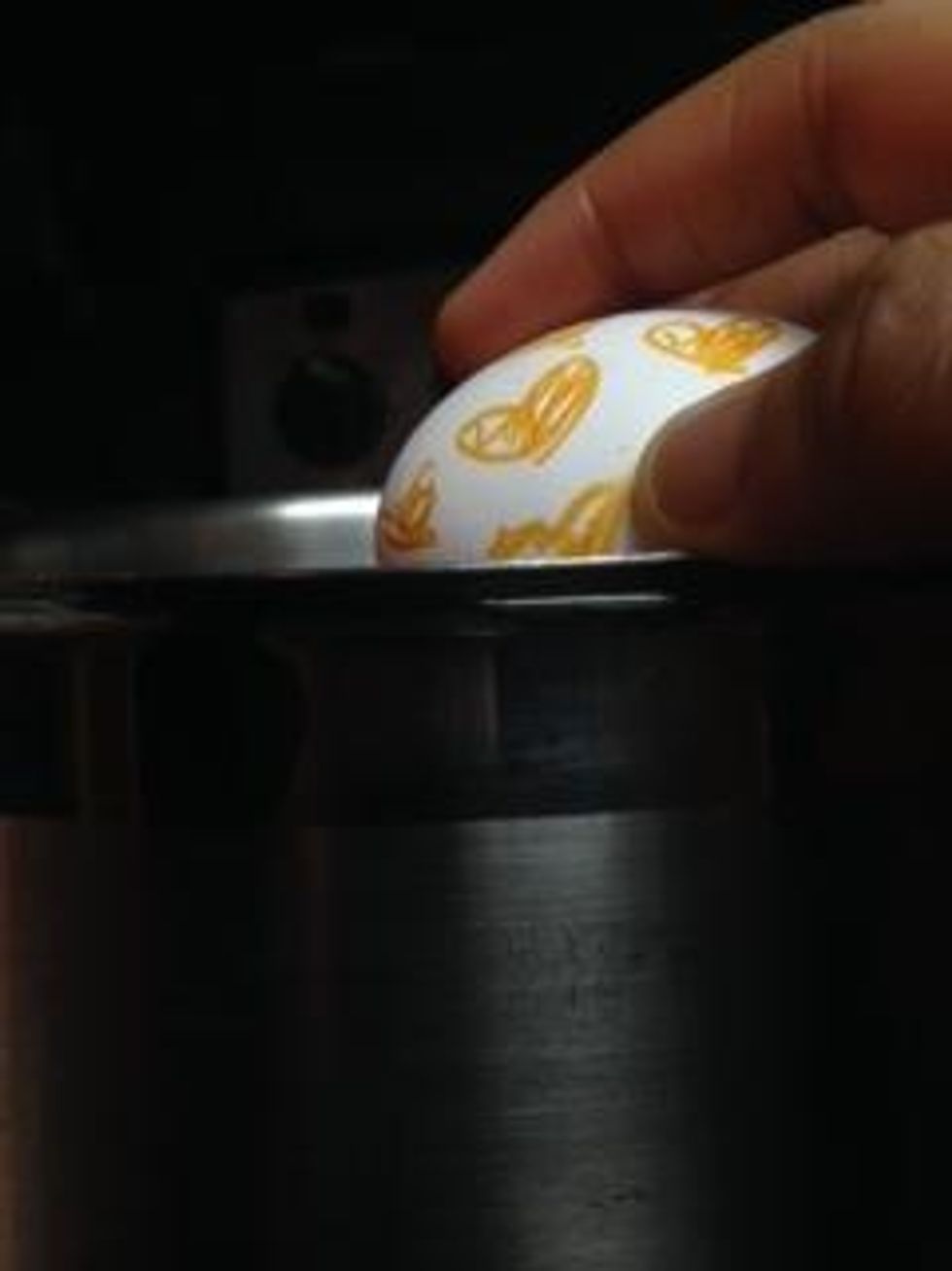 Dip your eggs into the solution one at a time.