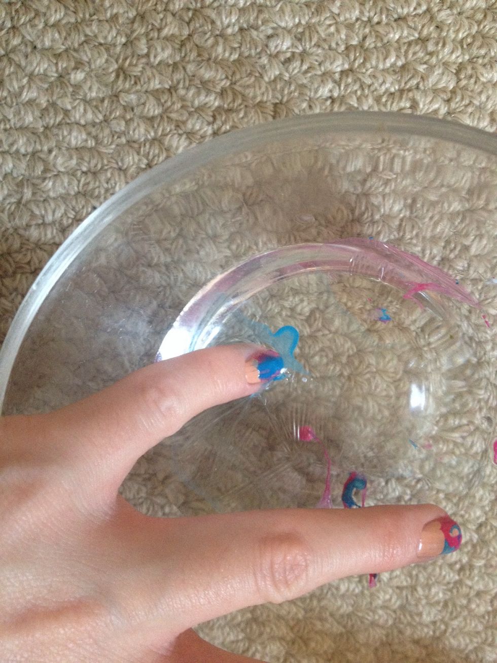 Dip your finger in so that the varnish grabs onto your nail. It can take a little practise and be a bit messy. So have some nail varnish remover handy! Wipe the excess from around the nail with q-tips