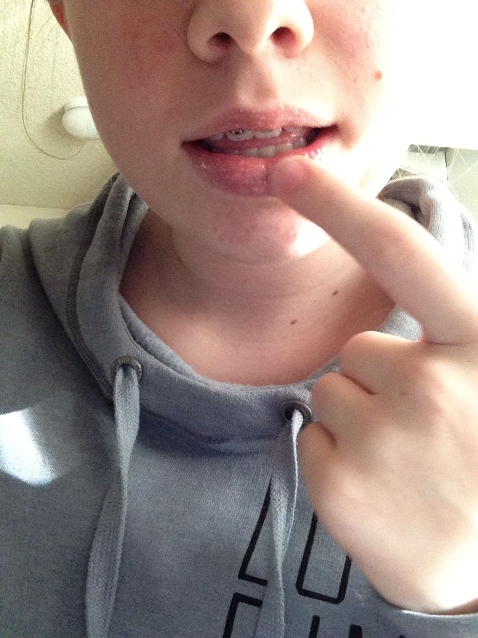 Dip your finger in the mixture, then smooth it on your lips.