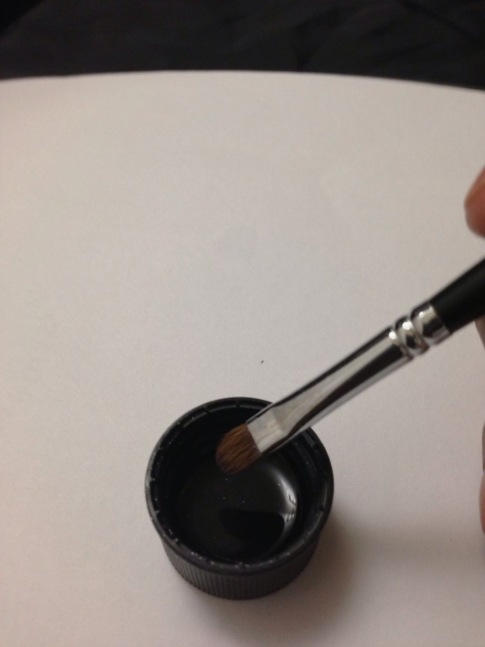 Dip your q-tip or nail brush into the solution and clean the excess nail polish off your fingers and around your cuticle.