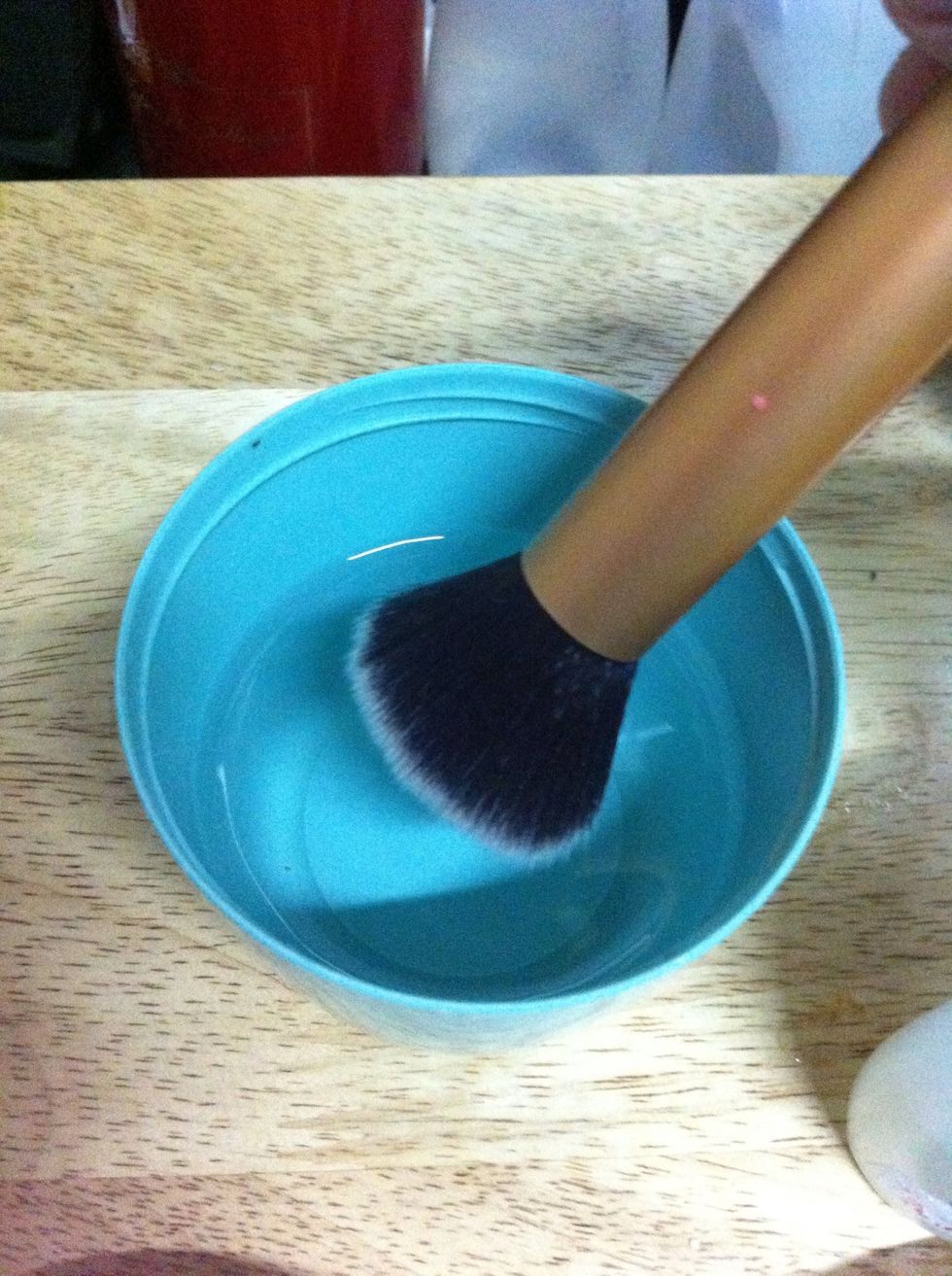 Dip your used brushes in the container with warm water. Make sure its not full, just enough to thoroughly wet the bristles.